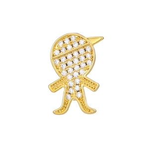 Macro detail of a gold boy silhouette brooch with sparkling cubic zirconia inlay