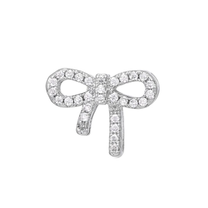 Detailed macro view of bow charm accessory with pavé-set round cubic zirconia stones