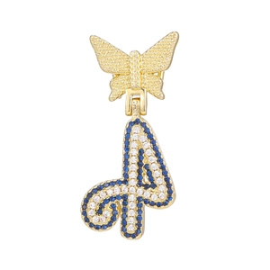 Detail of a golden butterfly pendant with a blue and white crystal encrusted number 4 charm