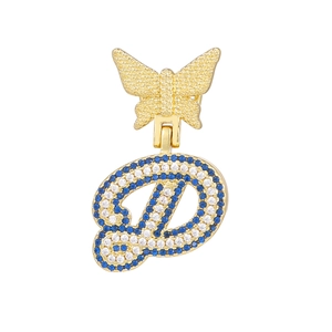 Detail of crystal paved butterfly and letter D pendant in gold finish with blue stones