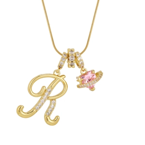 Golden necklace featuring a sparkling letter R and pink heart planet charm pendant