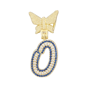 Macro view of butterfly pendant with letter O featuring blue and white rhinestones