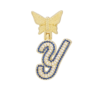 Detailed view of butterfly bail with blue and white zircon pavé gold letter y pendant