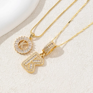 Golden pendant necklace with crystal letter K and sparkling cubic zirconia stones
