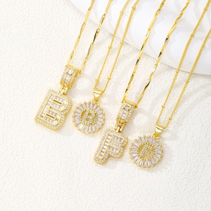 Gold plated iced out alphabet B and F pendant necklaces with sparkling cubic zirconia