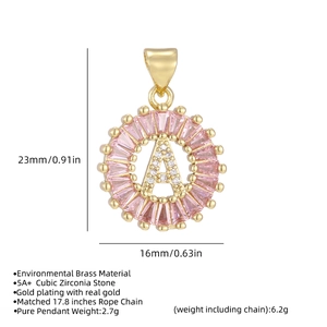 Detail view of gold letter A pendant featuring pink baguette and white cubic zirconia