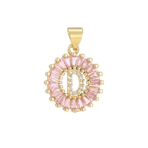 Macro shot of letter D pendant with pink baguette zircons and white pave-set diamonds