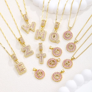 Pink iced out 26 letters pendant necklaces set with copper zircon and gold plating