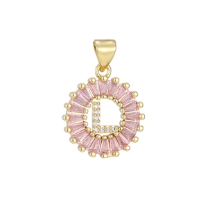 Macro detail of the letter L pendant with pink zircon border and gold plating