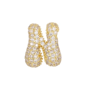 Macro detail of bubble letter H pendant with 18k gold plating and micro-pave zircons
