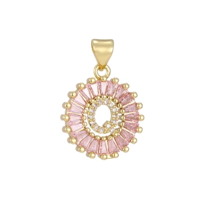 Macro detail of gold letter Q pendant with pink baguette stones and pavé cubic zirconia