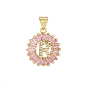 Detail of gold letter R pendant with pink rectangular crystals and micro-pave diamonds
