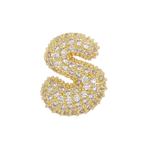 Macro shot of 18k gold bubble letter S pendant with pavé cubic zirconia setting