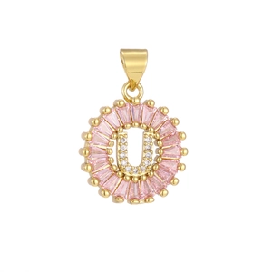 Macro shot of letter U pendant with pink rectangular crystals and white zircon stones