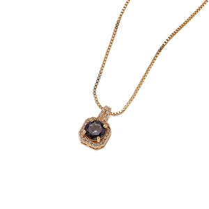 Collar de frasco de perfume dorado con colgante octogonal y gema central púrpura