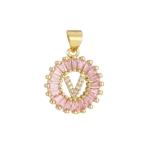 Detailed view of gold plated V pendant with pink baguette stones and white zircons