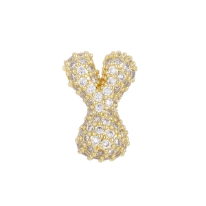Macro detail of the golden Y letter pendant encrusted with clear cubic zirconia crystals