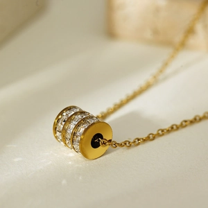 Elegant gold titanium steel necklace with multi-layer crystal paved cylinder pendant
