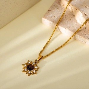 Golden sun flower pendant necklace with tiger eye stone and crystals on rope chain