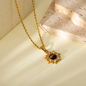 Vintage sunburst pendant necklace with tiger eye stone and gold rope chain details
