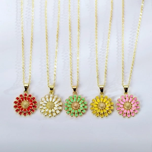 Detailed view of colorful enamel sunflower pendants on elegant gold-plated necklaces