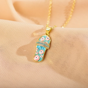Chic gold-plated slipper pendant necklace with blue enamel evil eye and sparkling zircons