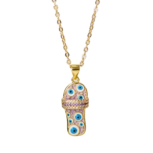 Golden necklace featuring a pink enamel evil eye flip-flop pendant with sparkling crystals