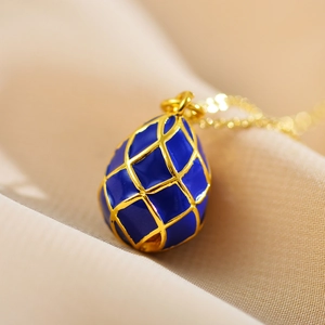 Deep blue enamel planet pendant necklace with golden lattice detail in Faberge style