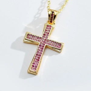 Fashion cross pendant necklace with gold plating and pink cubic zirconia stones