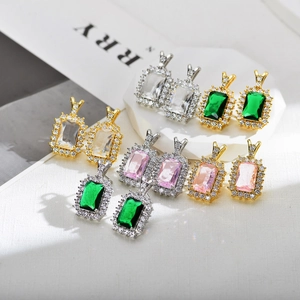Sparkling rectangular halo earrings with emerald and pink stones in gold and silver plating
