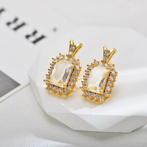 Elegant gold-plated earrings with emerald-cut zirconia and shimmering halo frame