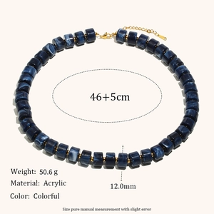 Blue marble acrylic cylinder necklace with gold metal spacers and lobster clasp detail