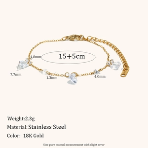 Detail view of 18K gold plated stainless steel bracelet with heart zircon charms