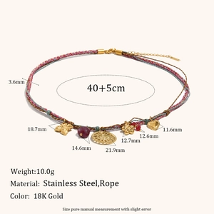 Detail view of colorful woven necklace with 18K gold charms showing size and weight specs