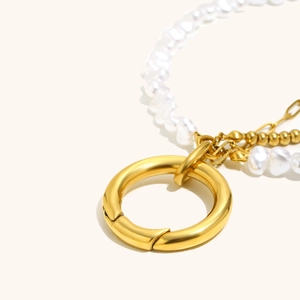 Detail of 18K gold plated bead chain with pearl and heart pendant toggle clasp