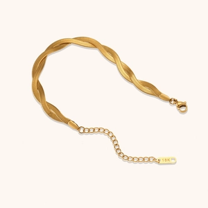 Detail of twisted double snake chain bracelet with 18K gold plating and lobster clasp