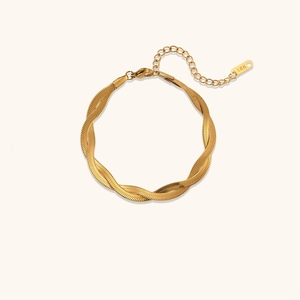 Detail of 18K gold plated double-stranded braided herringbone snake chain bracelet