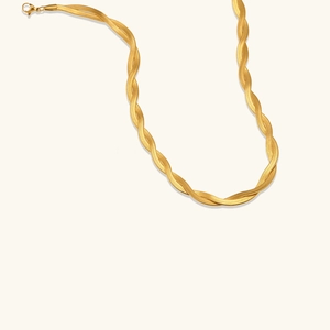 Detailed macro shot of the double-strand gold flat snake chain with lobster clasp closure
