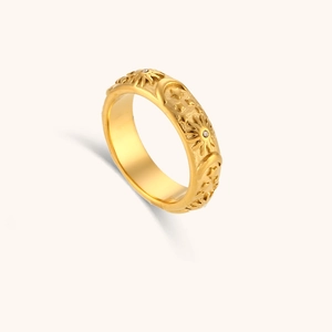 Detail showing vintage sun moon and star motifs on a 18K gold plated stainless steel ring