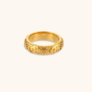 Detailed macro view of 18K gold plated ring featuring sun and moon relief with zircons