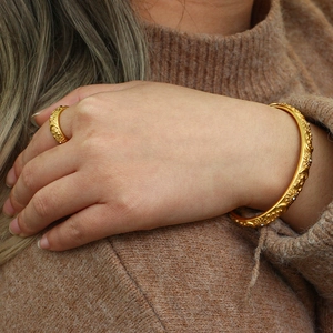 Detail of 18K gold plated bangle and ring set with celestial starburst and zircon studs