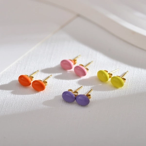 Set of four pairs of minimalist colorful oval stud earrings with elegant golden metal base