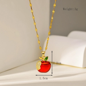 Detail view of a 3g red enamel apple pendant with zircons and 2.2cm height on gold chain