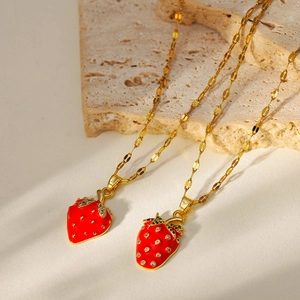 Mini red strawberry pendant necklace set with gold chain and white sparkling rhinestones
