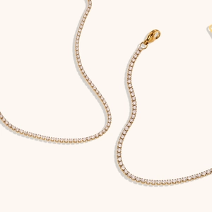 Macro shot of 18K gold plated tennis chain with 2mm cubic zirconia and lobster clasp