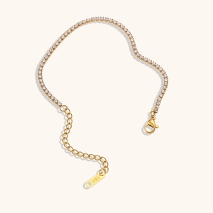 Close-up of 18K gold plated tennis bracelet with 2mm cubic zirconia and lobster clasp