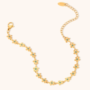 Golden flower bracelet with blue enamel petals and adjustable lobster clasp chain