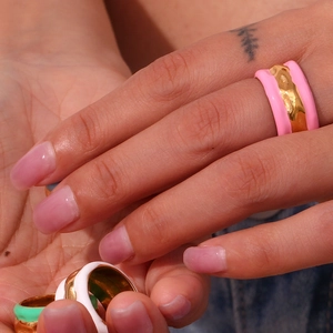Detail of gold-plated stainless steel ripple ring with colorful enamel drip glaze