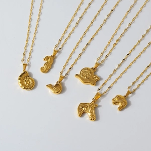 Collection of 18K gold plated stainless steel pendants with animal and sea life textures