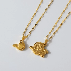 Detailed close-up of 18K gold-plated snail and whale texture pendants on wavy chains
